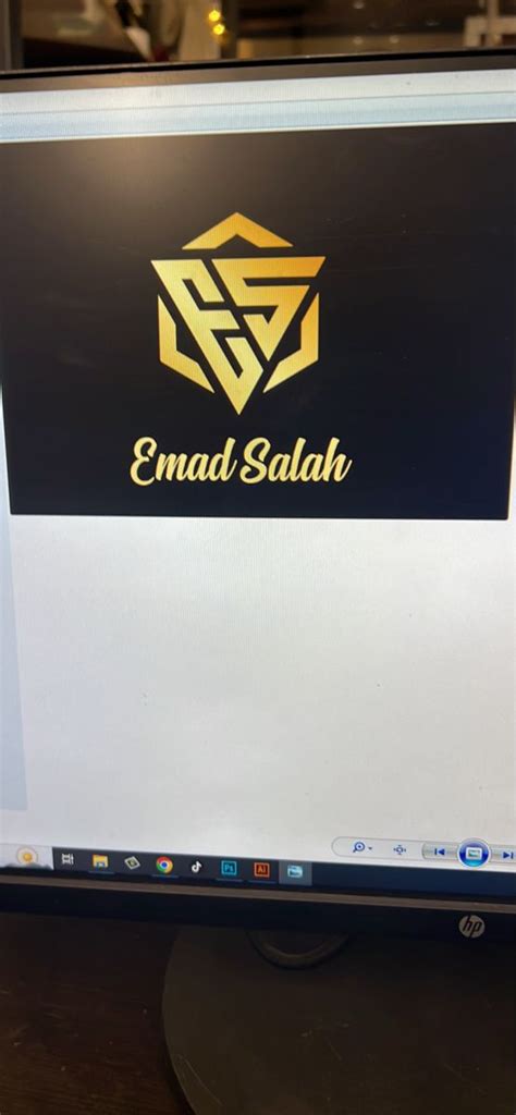 A Computer Screen With The Emad Salah Logo On It S Display Panel