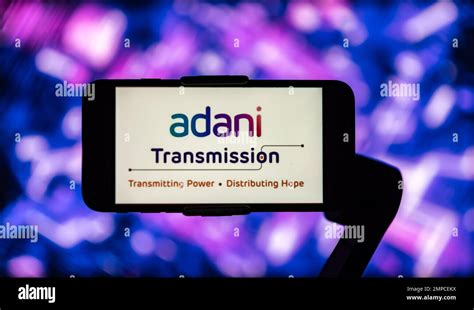 In this photo illustration, the logo of Adani Transmission seen ...