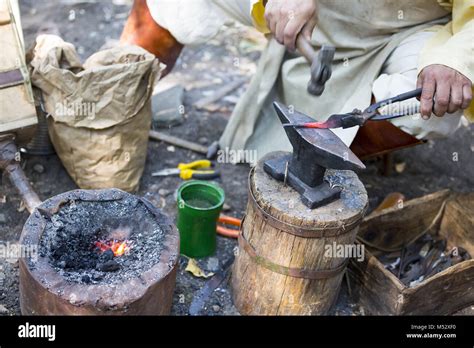 Blacksmith Hammering Hot Metal Arrow Stock Photo Alamy