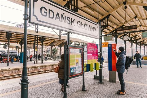 Passengers Waiting For A Train At The Platform Of Gdansk Glowny Railway