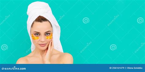 Young Girl Has Collagen Golden Eye Patches On Face With Towel