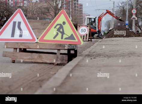 Road Signs Detour Road Repair On Street Background Truck And
