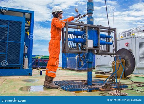 Offshore Oil And Gas Industry Oil Rig Worker Inspect And Setting Up