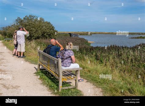 Birdwatchers At Titchwell Marsh Rspb Bird Reserve Norfolk Stock Photo