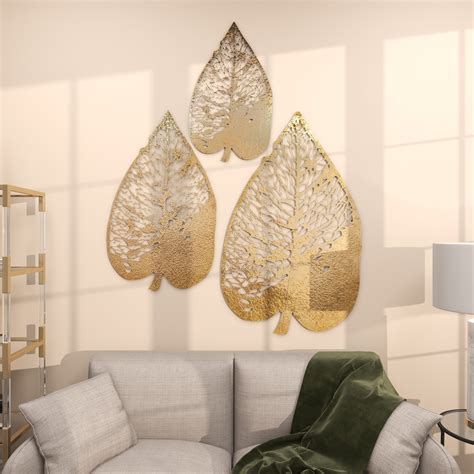 The Novogratz Gold Metal Leaf Home Wall Decor With Laser Cut Detailing