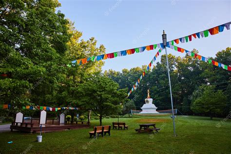 Premium Photo | Cultural center with chorten and prayer flags