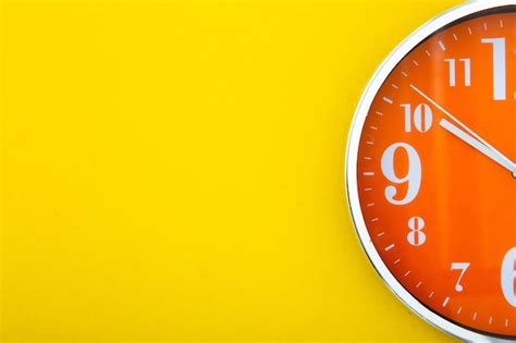 Premium Photo Alarm Clock On Isolated Yellow Background