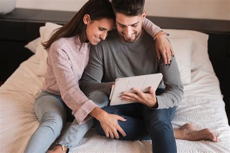 Free Photo Couple Laughing At Tablet