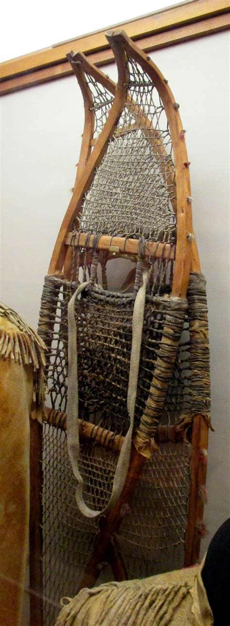 An Old Wooden Sled Sitting On Top Of A Wall
