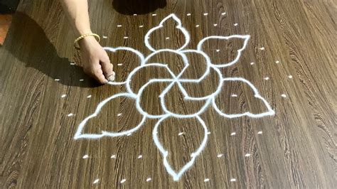 Simple Flower Rangoli Design With Beautiful Colours And 11x6 Dots For