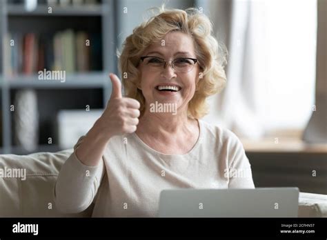 Head Shot Portrait Smiling Mature Woman Showing Thumb Up Stock Photo Alamy