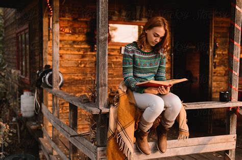 Woman Reading A Book Del Colaborador De Stocksy Milles Studio Stocksy