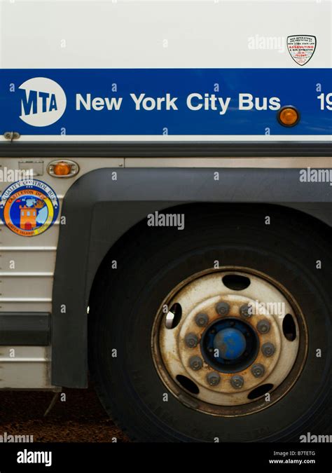 Wheel and side of a New York City MTA bus showing MTA logo Stock Photo - Alamy