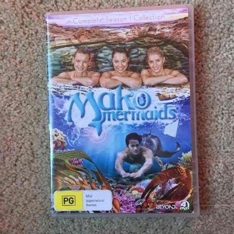 The Dvd Cover For Mako Mermaids Is Laying On The Floor Next To It S Case