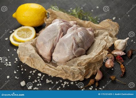 Raw Quail Meat on Kitchen, Cooking Gourmet Bird. Healthy Diet Recipe