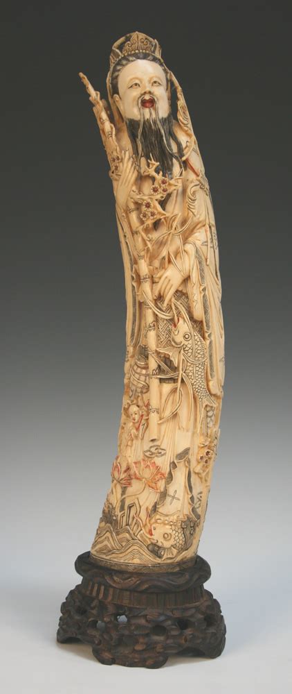 A Chinese ivory tusk carving, 20th Century, carved and stained in the ...