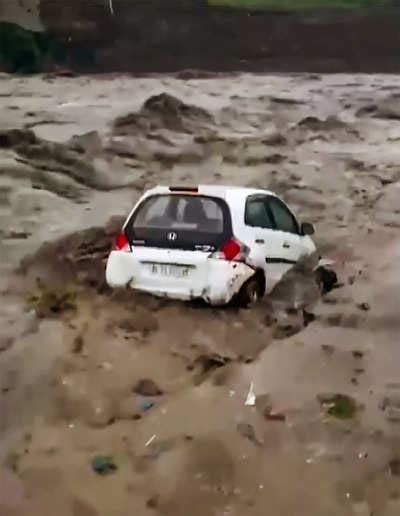 Watch Vehicles Swept Away In Beas River Amidst Heavy Rainfall In