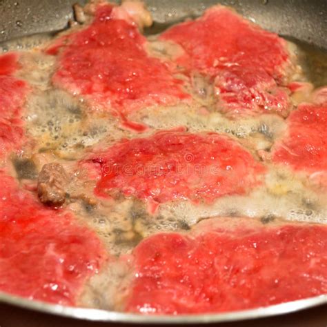 Fresh Red Cow Tenderloin Frying In Pan On Stove Homemade Food Stock