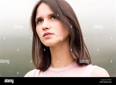 Portrait Of Young Woman Watching Something Stock Photo Alamy