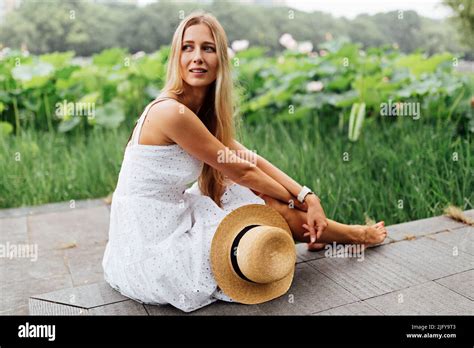 Portrait Of Beautiful Stylish Blonde Millennial Woman Posing Outdoor