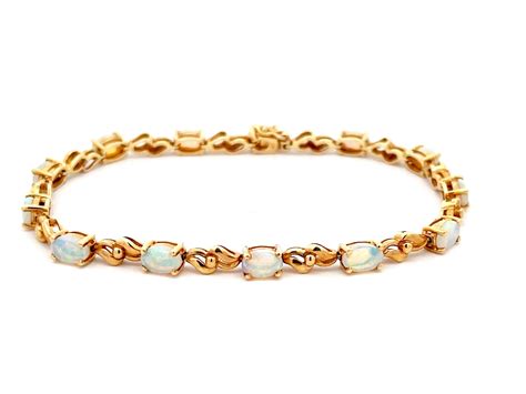 Opal Tennis Bracelet In 14k Yellow Gold Solitaire Jewelers