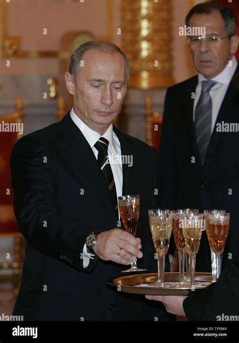 Russian Foreign Minister Sergei Lavrov R Looks As President Vladimir