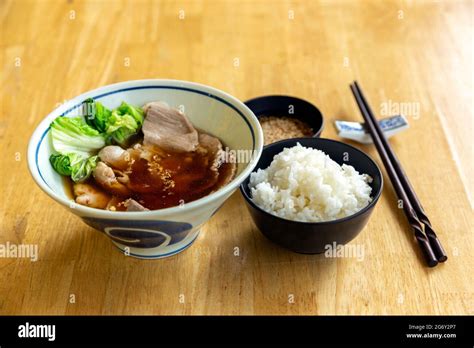 Japanese Soup With Pork Serve With Rice And Suki Yaki Sauce On Wood