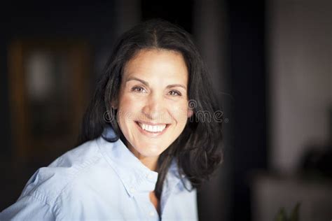 Mature Spanish Businesswoman Smiling At The Camera At The Office Stock