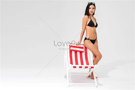 Black Bikini Beauty Sits On The Beach Chair Picture And Hd Photos