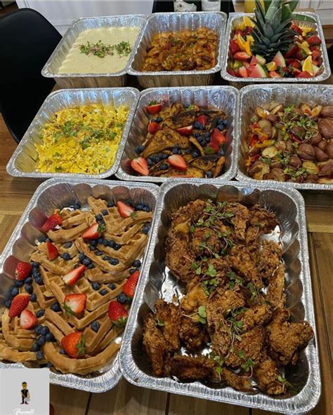 Several Trays Filled With Different Types Of Food