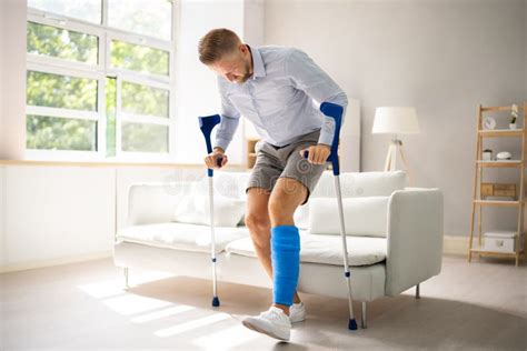 Man With Broken Leg After Accident Stock Image Image Of Floor Afro