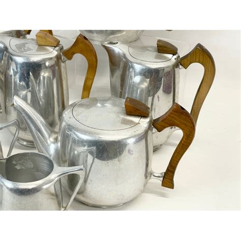 11 Pieces Of Mid Century Picquot Ware 3 Teapots 5 Coffee Pots 3 Milk