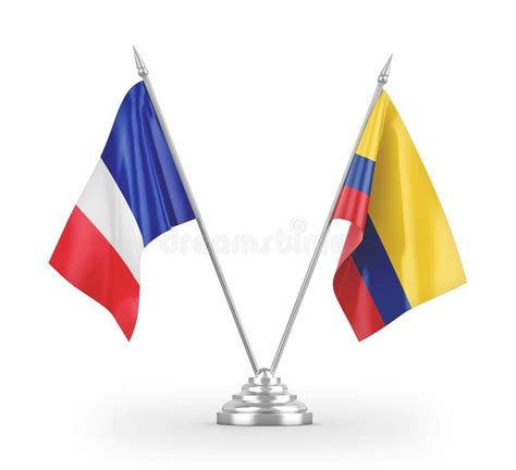 France And Colombia Two Flags On Flagpoles And Blue Cloudy Sky Stock