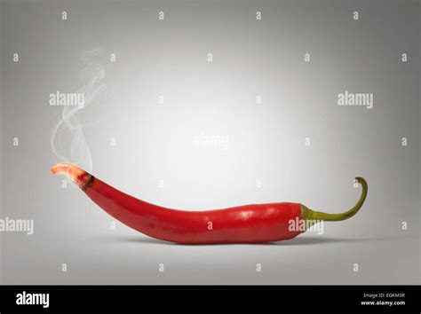 A Smoking Hot Chili Pepper With A Glowing Hot Tip Stock Photo Alamy