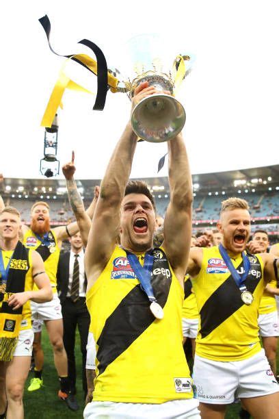 Tigers Captain Trent Cotchin Celebrates With Team Mates And Holds The Afl Premiership Cup Aloft