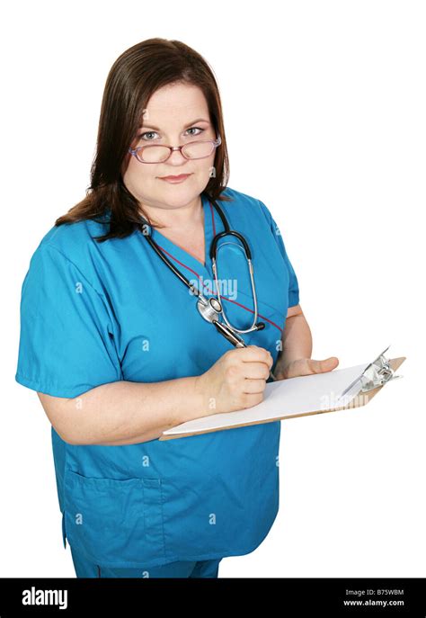 Serious Plus Sized Nurse Taking Notes In A Medical Chart Isolated On