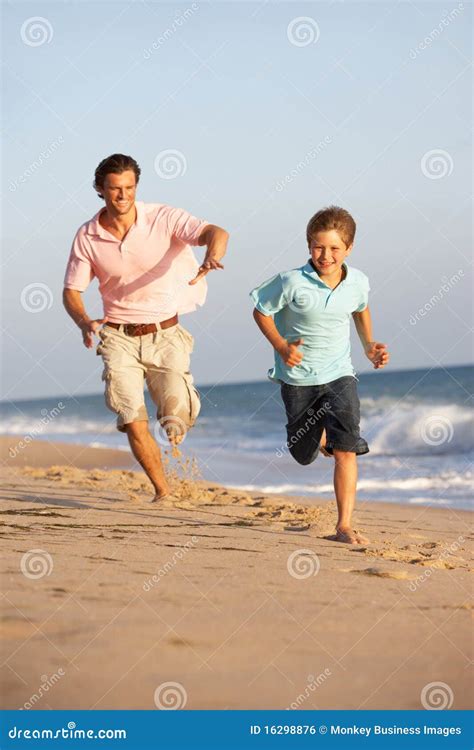 Father And Son Running Along Summer Beach Stock Photo Image Of