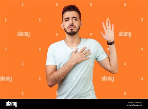 I Promise Portrait Of Serious Brunette Man With Beard In White T Shirt