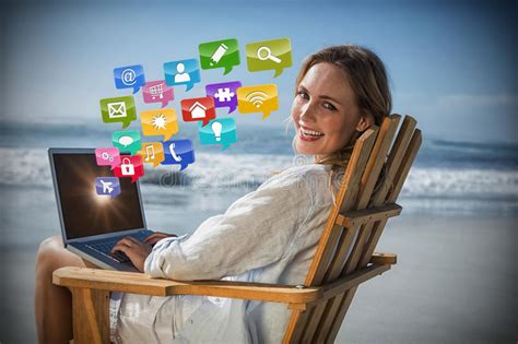 Composite Image Of Gorgeous Blonde Sitting On Deck Chair Using Laptop