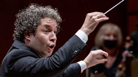 Los Angeles Philharmonic conductor Gustavo Dudamel conducts as María Dueñas, violinin, performs ...