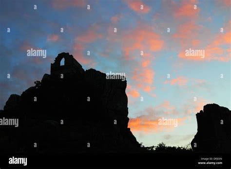 Evening Sky With Silhouette Of Rocky Outcrop And Ruined Chapel Stock