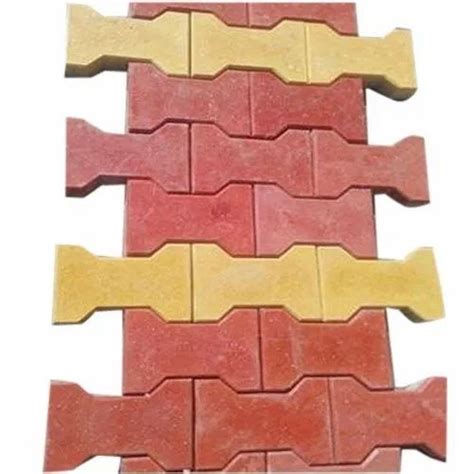 Red And Yellow Concrete Interlocking Dumbbell Paver Block At 14 Piece