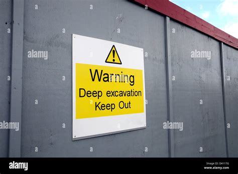 Warning Sign Deep Excavation On Building Site Hoarding Stock Photo