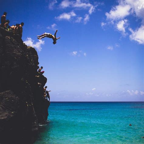 Cliff Jumping At Waimea Bay On North Shore Oahu Waimea Bay