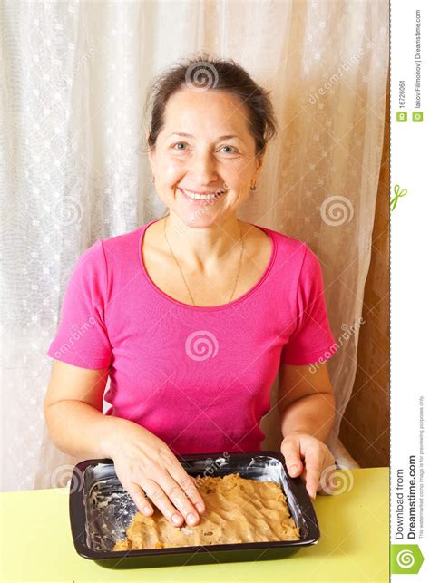 Woman Puts Dough Into Roasting Pan Stock Image Image Of Senior Dough 16726061