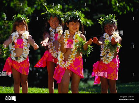 Young Keiki Hula Halau Dancing In Colorful Pareos With Haku And Leis