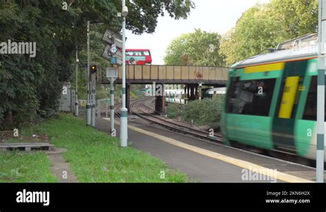 Trains arriving at and leaving Wandsworth Common station, London Stock ...