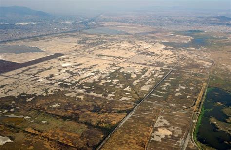 The dry bed and remnant lagoons of Lake Texcoco | Lake texcoco, Mexico ...