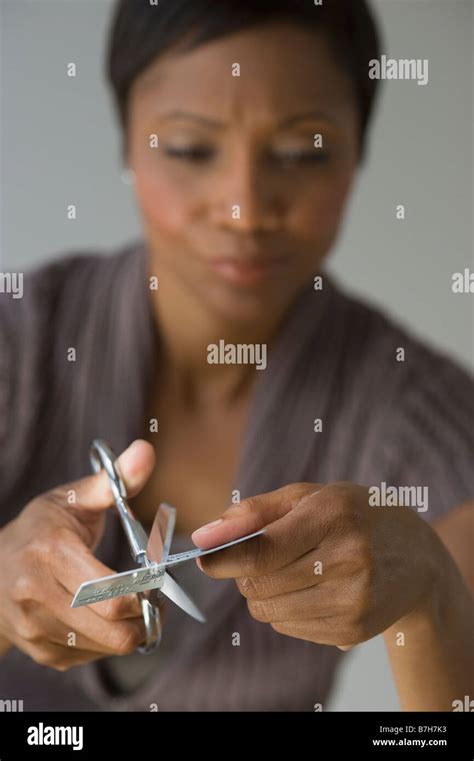 Frustrated African Woman Cutting Up Credit Card Stock Photo Alamy