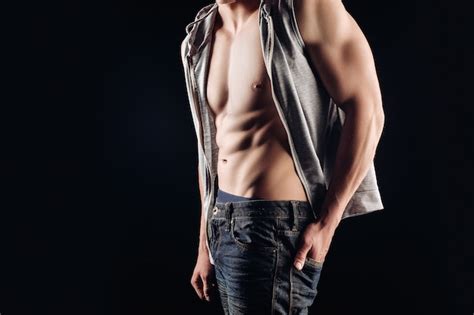 Premium Photo Close Portrait Of A Naked Torso A Man In A Shirt Undone A Denim Outfit Naked